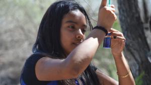 Student doing science in the field. 
