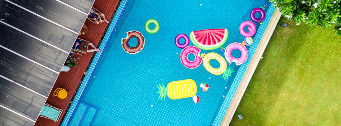Overhead photo of a pool with inflatable devices. 